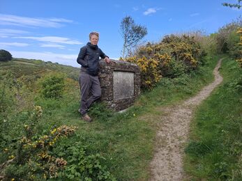 Kate Langdon at Marsland Reserve, recreating the image of David Attenborough standing by the memorial
