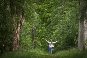 Woman loving wildlife in the woods