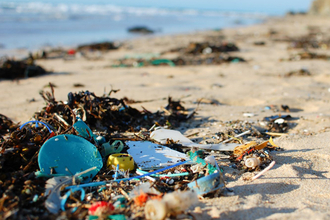 Plastic and waste on the sand