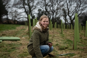 Girl planting trees