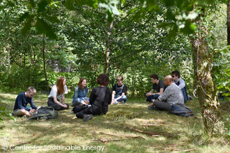 Group of young people under trees