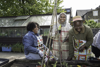 Three woman at a community garden