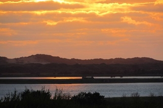 sunset over the water at Horsey Island