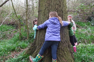 Children tree hugging by Debs Richardson Bull
