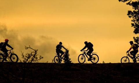 Bikes at sunset on a hill 