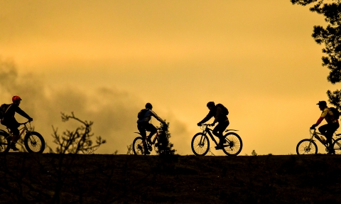 Bikes at sunset on a hill