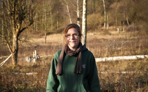 Elaine stands on a nature reserve