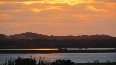 sunset over the water at Horsey Island