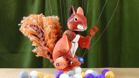 A red squirrel puppet ready to tell you a story