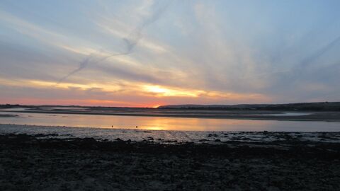 Sunset over the quay with the tide out