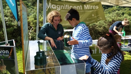 Children using the bog model at an event 
