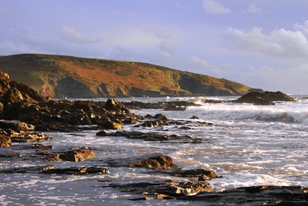 Waves crashing against the rocks at Wembury beach