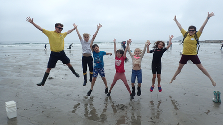 Wembury Beach Summer Holiday Club children jumping