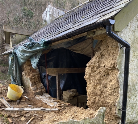 Cob wall needing repair