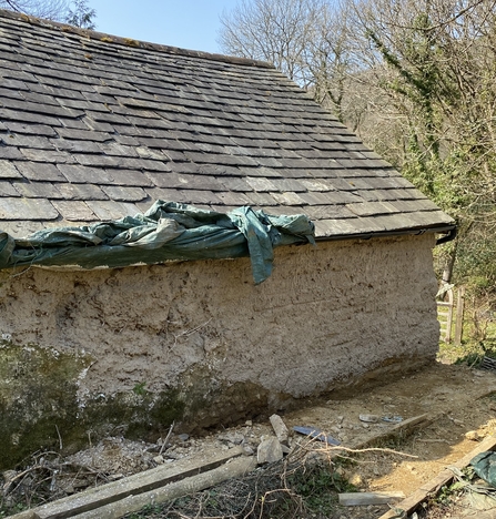 Cob wall on barn repaired