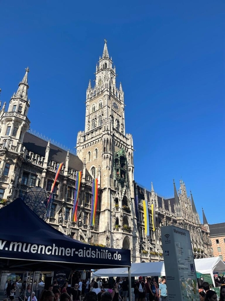 Marienplatz city hall building in Munich with Pride flags