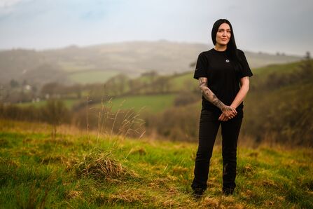 Claire standing proud on hillside