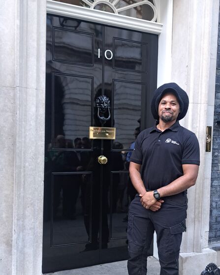 Randy stood proudly in front of the black door of 10 Downing Street