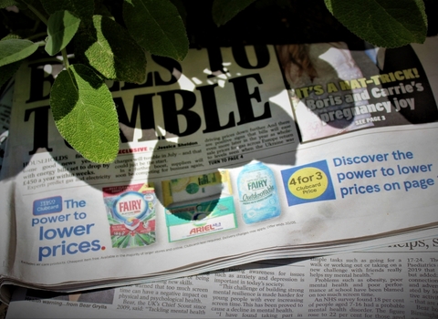 Newspapers and in the shade of leaves